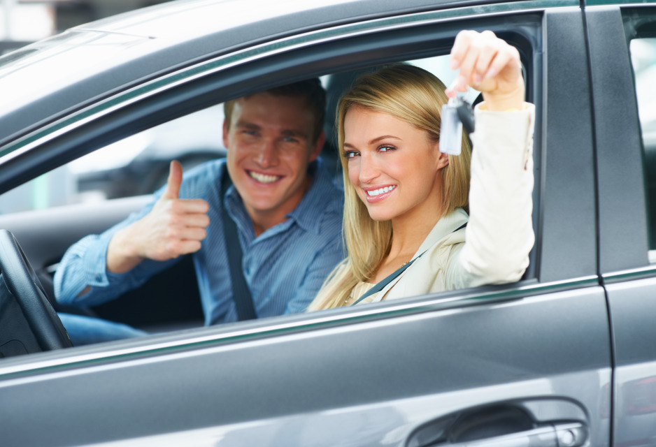 Millennial couple in new car they just purchased - Redline Affinity Group auto dealership marketing