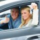 Millennial couple in new car they just purchased - Redline Affinity Group auto dealership marketing