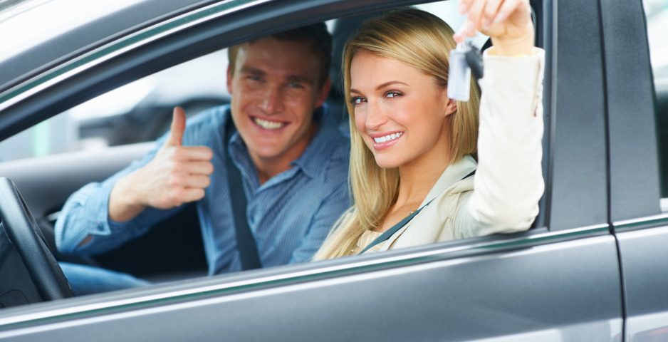 Millennial couple in new car they just purchased - Redline Affinity Group auto dealership marketing